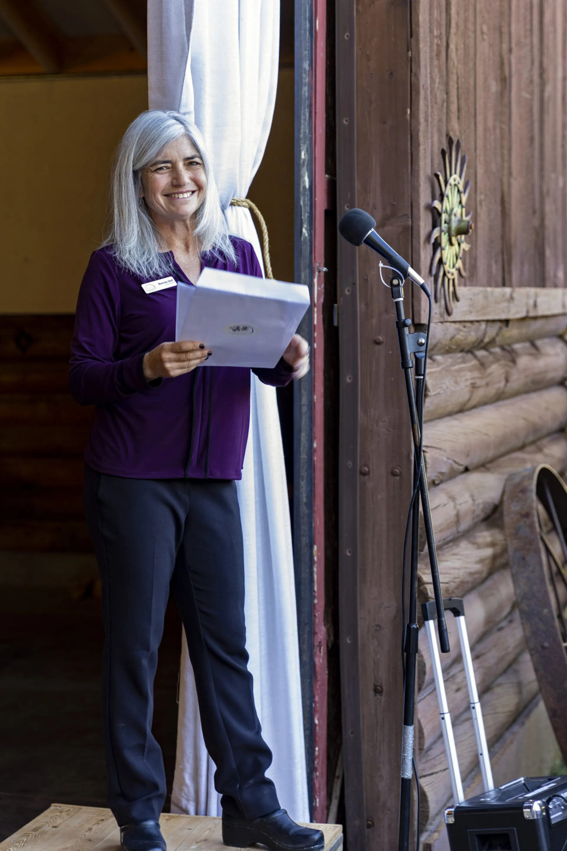 Community Foundation staff sharing updates at a Teton Valley nonprofit event