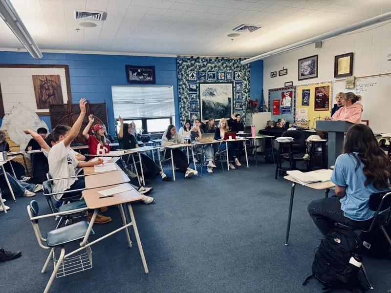 Teton Valley students raising hands during a Youth Philanthropy classroom session